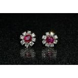 A pair of pinky red ruby and diamond floral stud earrings,