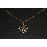 A Art Nouveau peridot and 9ct gold pendant necklace,