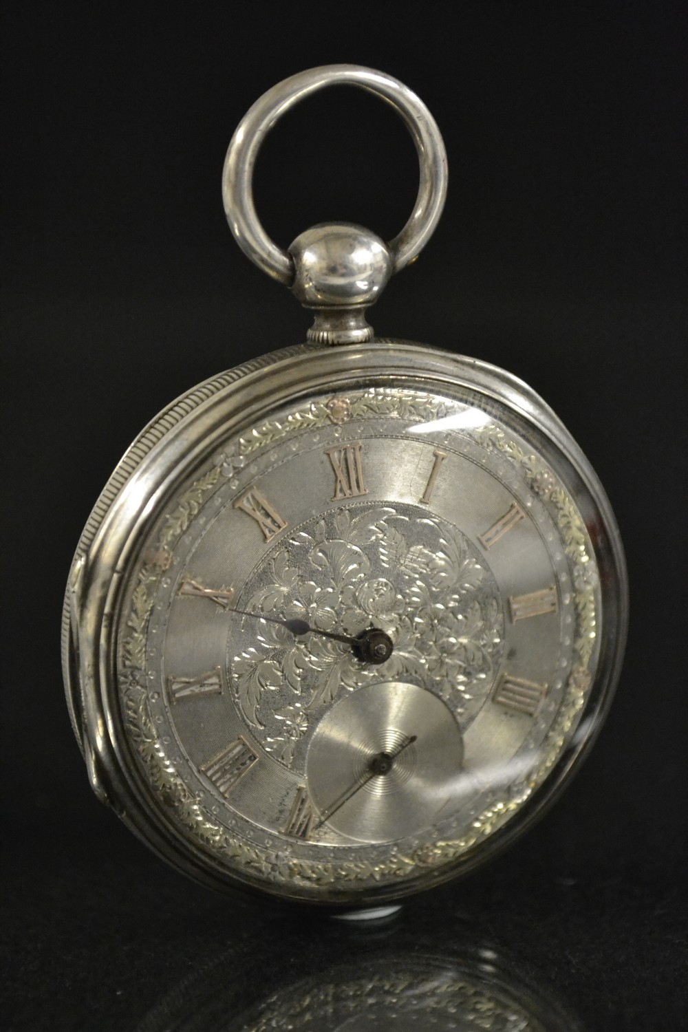 A Swiss silver open face pocket watch, C Guinand, Geneva, silver dial, bold Roman numerals,