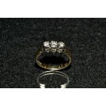 A diamond trilogy ring, three linear set round old brilliant cut diamonds,