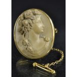 A late 19th/early 20th century carved lava cameo brooch, Flora facing left, 9ct gold frame,