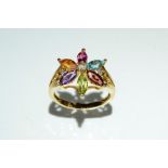 A multi stone flower head ring,