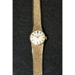 Omega - a Ladys 9ct gold bracelet watch, circular silvered dial, baton markers,