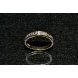 A diamond half eternity ring, inset with nine round cut diamonds,