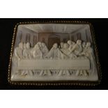 A gold mounted carved trapezoid shaped shell cameo brooch, The Last Supper,