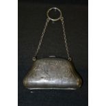An Edwardian silver chatelaine purse, shaped body, tan leather interior, Birmingham 1910, 9.