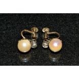 A pair of diamond and pearl earrings,