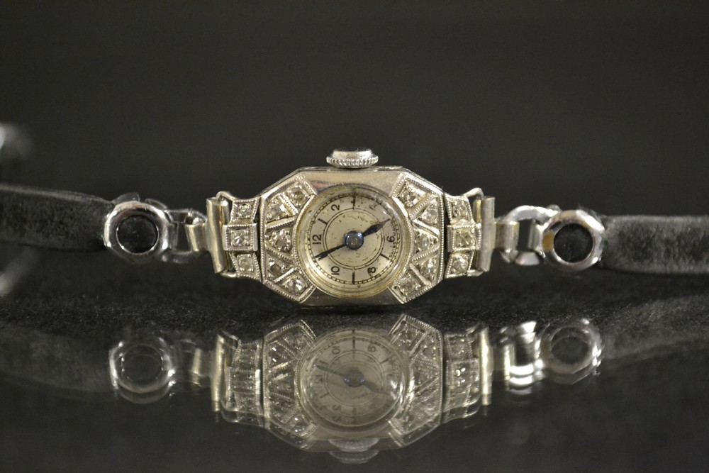 An Art Deco platinum and diamond cocktail watch,