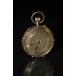 A lady's 14 ct gold cased fob watch, floral gilt dial, Roman numerals, minute track, blued hands,