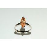A peach cubic zirconia dress ring, marquise cut peach stone, 9ct white gold shank, stamped 375 CZ,