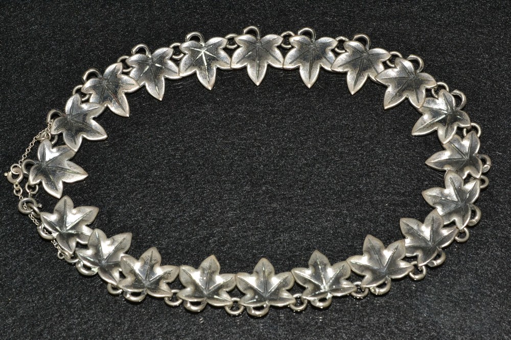 A retro sterling silver fancy link leaf necklace, composed of twenty cast maple leaf sections,