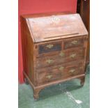 A George I walnut bureau, of small proportions,