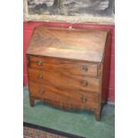 A George III mahogany bureau, fall front enclosing an arrangement of pigeon holes and small drawers,