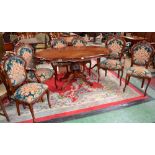 A 20th century reproduction Sorrentino style inlaid mahogany dining room suite,