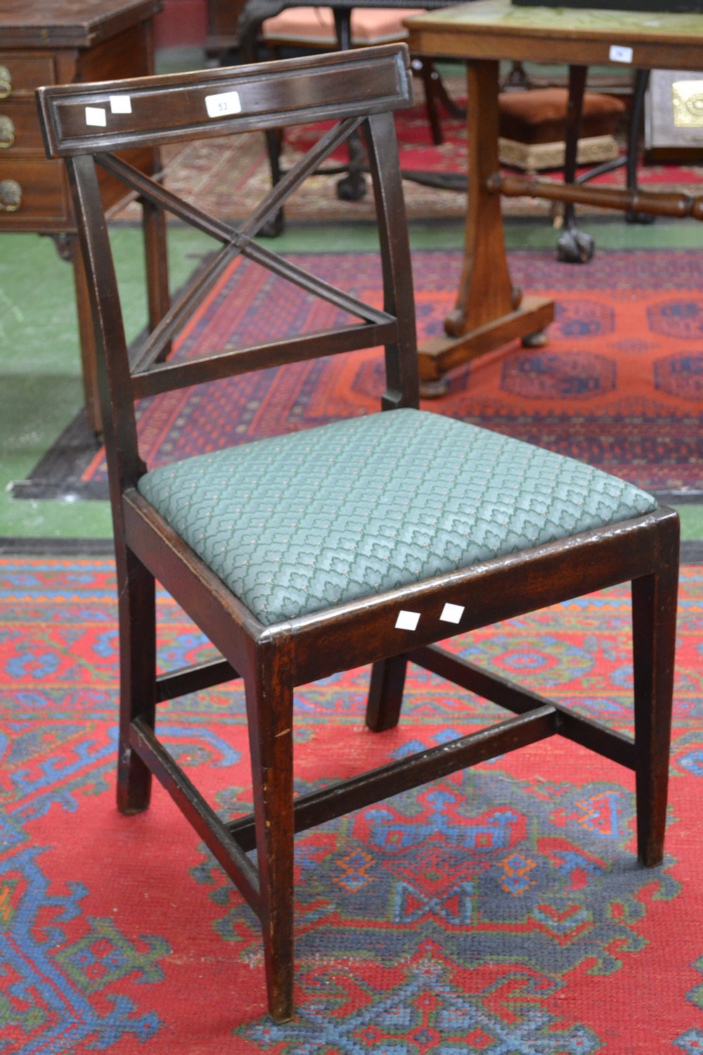 A Regency mahogany dining chair, curved top rail, cross framed back, drop in seat,