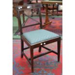 A Regency mahogany dining chair, curved top rail, cross framed back, drop in seat,