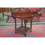 A Chippendale Revival square envelope mahogany card table, folding top, cluster column supports,