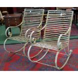A pair of wrought iron garden rocking chairs (2)