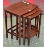 A Waring and Gillows mahogany nest of three tables.