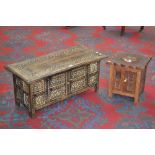 An Oriental style coffee table, two door cupboard to base,