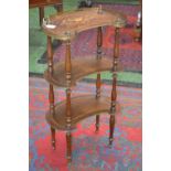 A French kingwood and marquetry kidney-shaped three-tier whatnot, the plateaux with matched veneers,