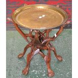 A North African collapsible tray top table, brass circular top,