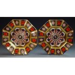 A pair of Royal Crown Derby 1128 octagonal plates, all gold borders,