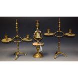 A pair of late 19th Century brass height adjustable two branch table candlesticks, shaped sconces,