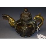 A Chinese parcel gilt bronze libation ewer and cover, lotus bud finial, dragon handle,