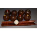 A set of wooden carpet bowls