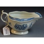 A Worcester sauceboat, painted in underglaze blue with sprays of flowers,