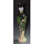 Moorcroft - an elongated baluster vase,