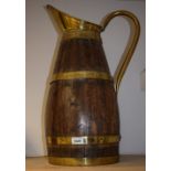 A large early 20th century brass mounted coppered jug, 59.