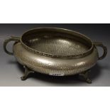An Arts and Crafts pewter two handled fruit bowl, palinished throughout, 26cm diameter,