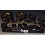 An African carved hardwood graduated elephant procession on stand