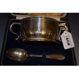 A George V silver christening set, of George I design, comprising porringer and spoon, hallmarked,