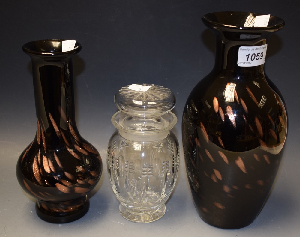 Glassware - a Monart style black and copper coloured glass onion vase; another similar;