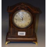 A mahogany cased mantel clock, string inlaid,