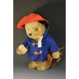 A Steiff Paddington Bear, 2003, mohair, red hat, blue coat, PB suitcase, white tag 354250, LE 5000,