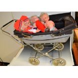 A Silver Cross coach built dolls Twins pram with two Minifon record p[laying talking dolls,