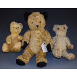 A mid 20th century mohair jointed teddy bear, amber and black plastic eyes,