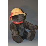 A Steiff Growling Teddy Bear, Moh Schwarz, Black alpaca, red leather collar, white tag 038150,
