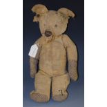 An early 20th century Steiff jointed bear, stud to ear, 40cm high, playworn, c.