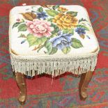 A beadwork and giltwood footstool