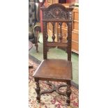 A Victorian oak hall chair, arched and carved top rail, spindled back, acanthus carved forelegs,