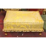 A Louis XVI revival giltwood footstool of large proportions, padded top, cabriole supports,