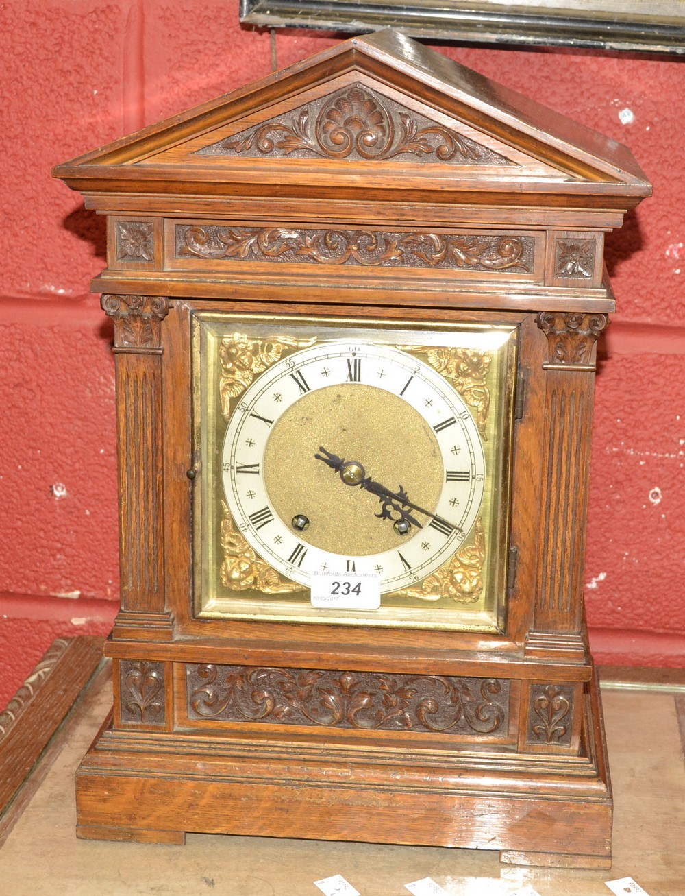 A Winterhalder and Hoffmeier oak bracket clock, architectural pediment, silvered chapter ring,