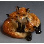 A Royal Worcester animal model, of three fox cubs, printed crown and circle mark in puce,