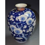 A Japanese ovoid vase, decorated in underglaze blue with cherry blossom,