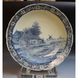 A large Boch blue and white charger, windmills and farm, floral border,